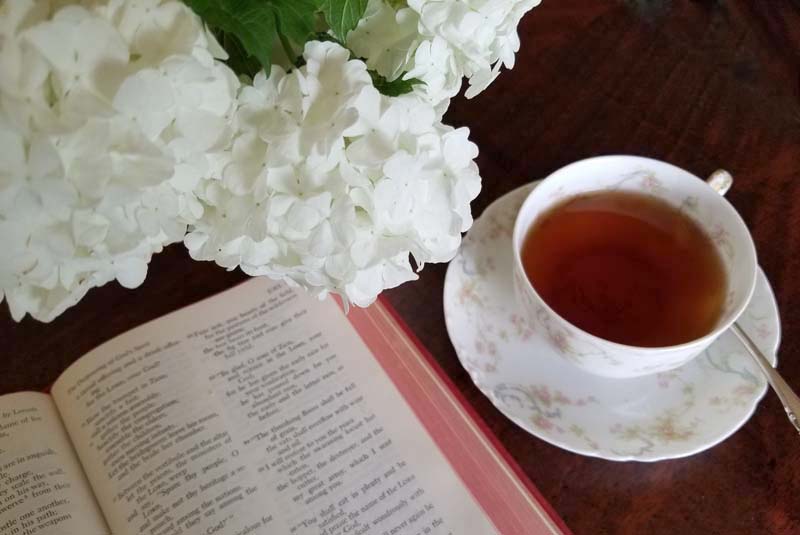 Tea, the Bible, and flowers from the garden